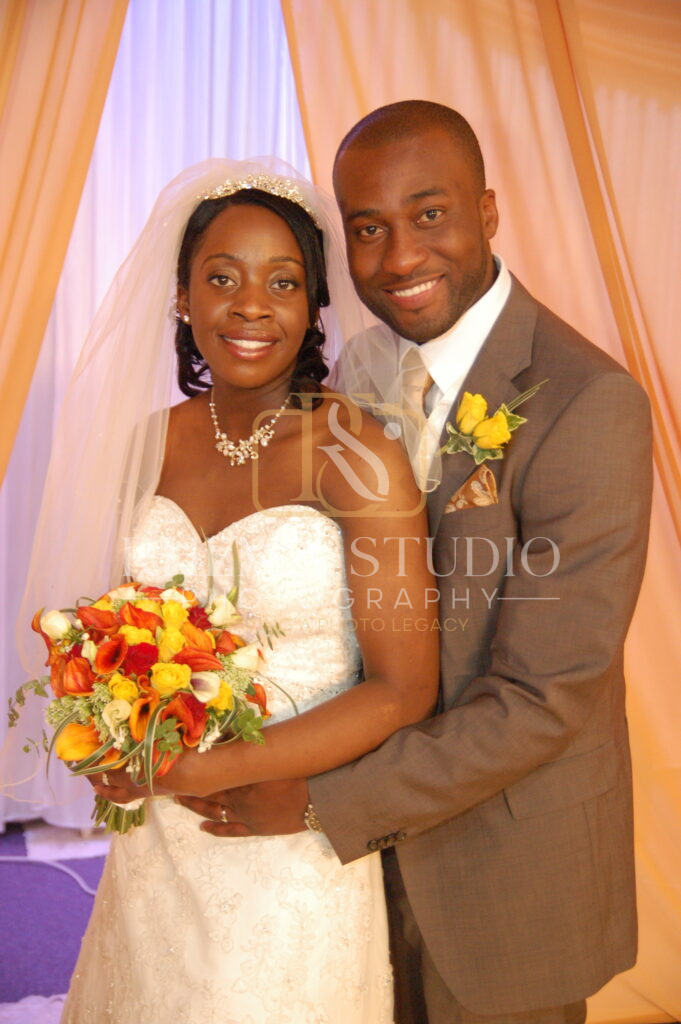 groom embracing the lovely bride